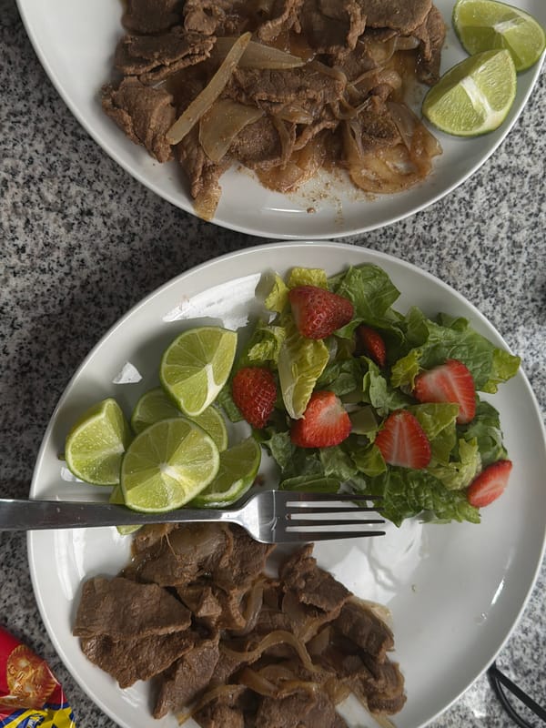 Beef and onion dinner served on gray countertop