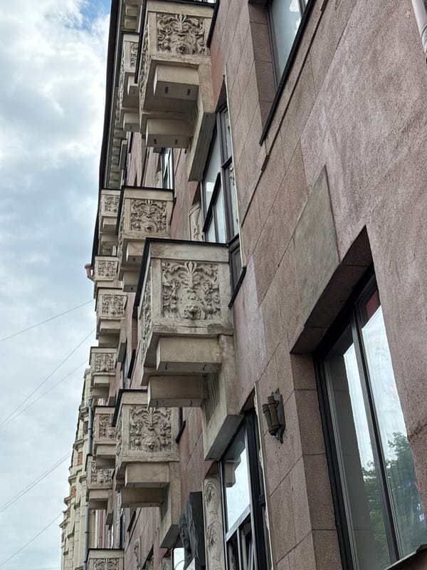 Tourist documents Saint Petersburg architecture and cafe during morning walk