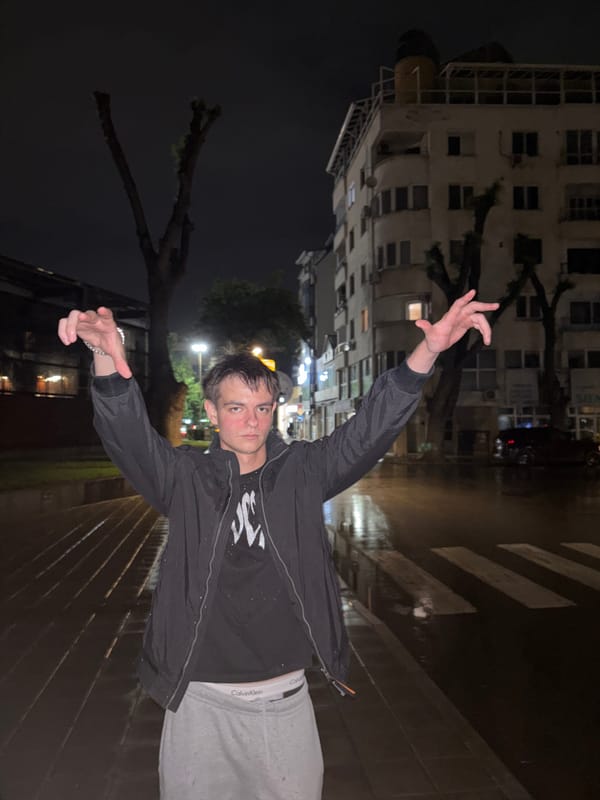 Young man observed walking Plovdiv streets on rainy evening