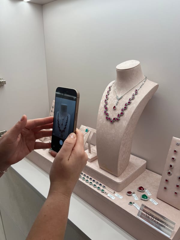 Selfies and jewelry browsing in a bright minimalist store