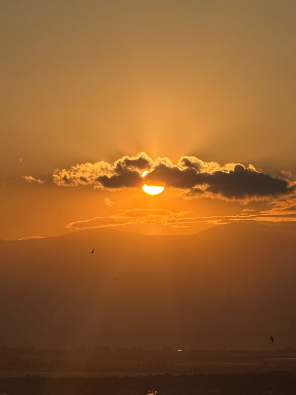 Sunset breaks through clouds over Abovyan, Armenia
