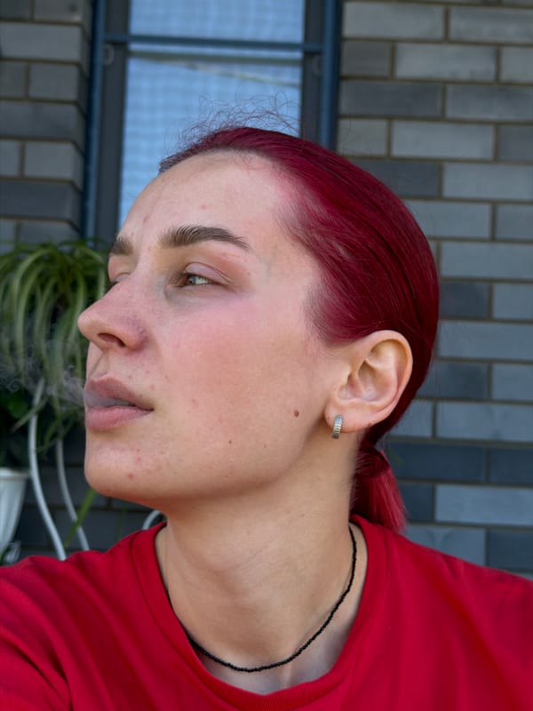 Red-haired woman vlogs with pets in Chaikovsky, Russia