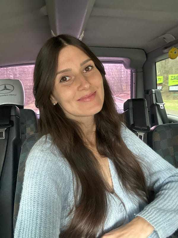 Woman in light blue sweater observed in Mercedes passenger seat