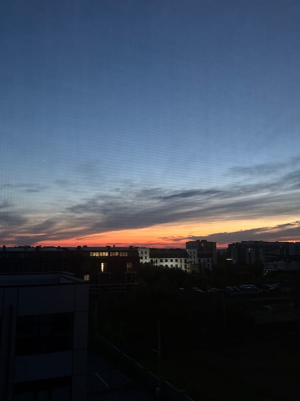City skyline at golden hour, dusk to dark