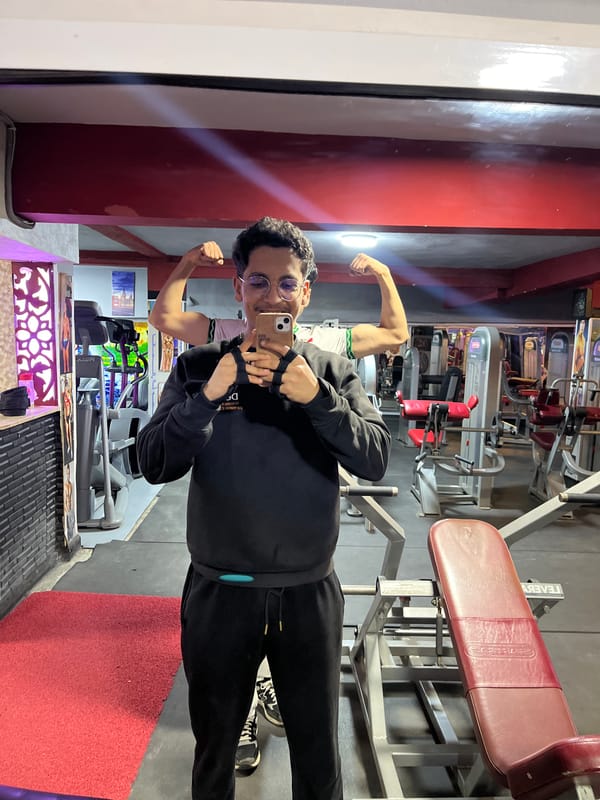 Young man exercises, takes selfie at Fez gym