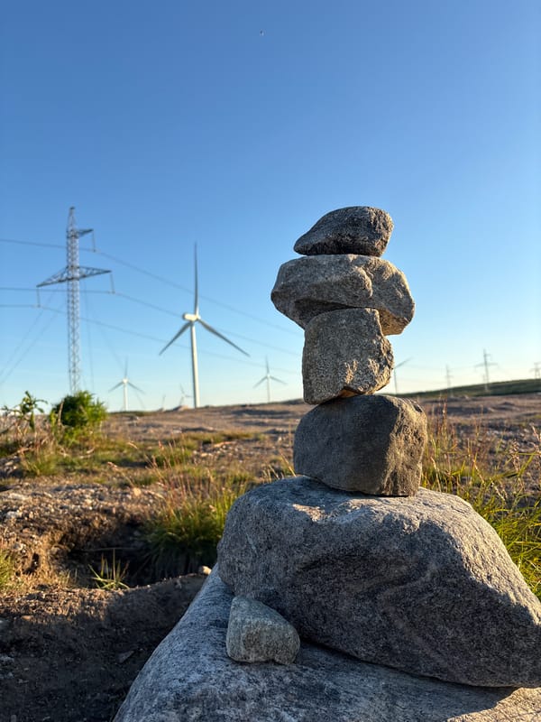 Rocky terrain and wind turbines on a Russian summer afternoon