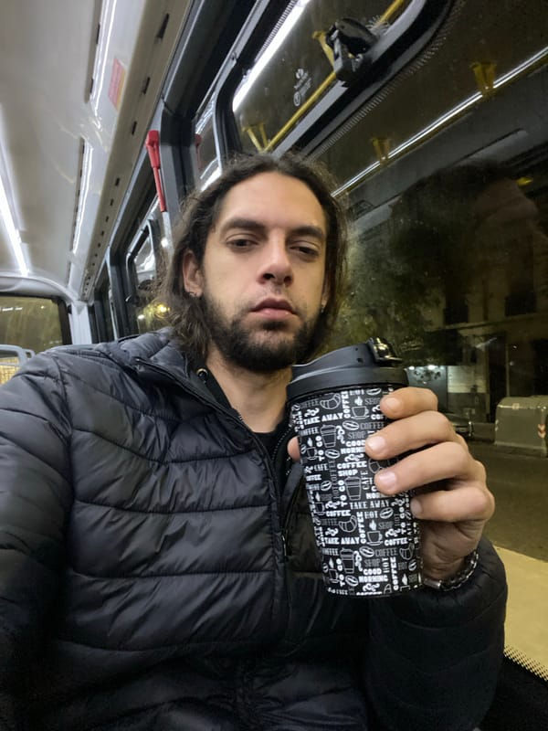 Man with coffee mug observed in Buenos Aires morning scene