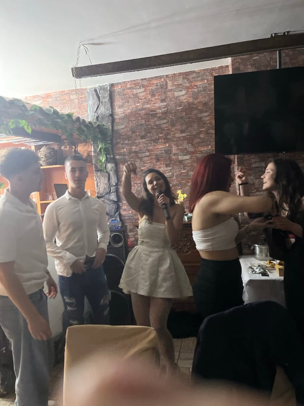 Indoor celebration with singing and dancing in Zlatograd, Bulgaria