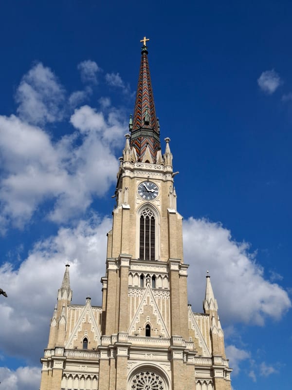 Visitor photographs historic Catholic church in Novi Sad