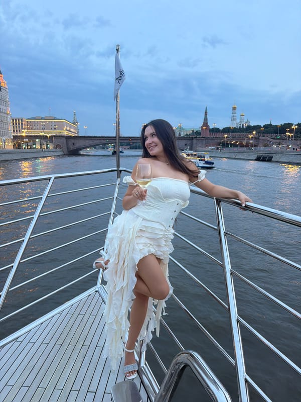 White wine and white dress on the Moscow River