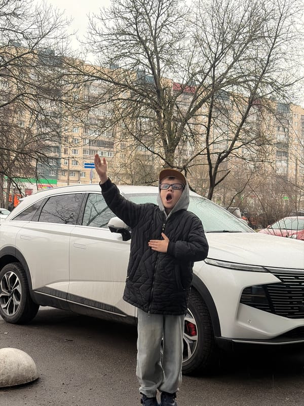 Family car trip through rainy Saint Petersburg streets