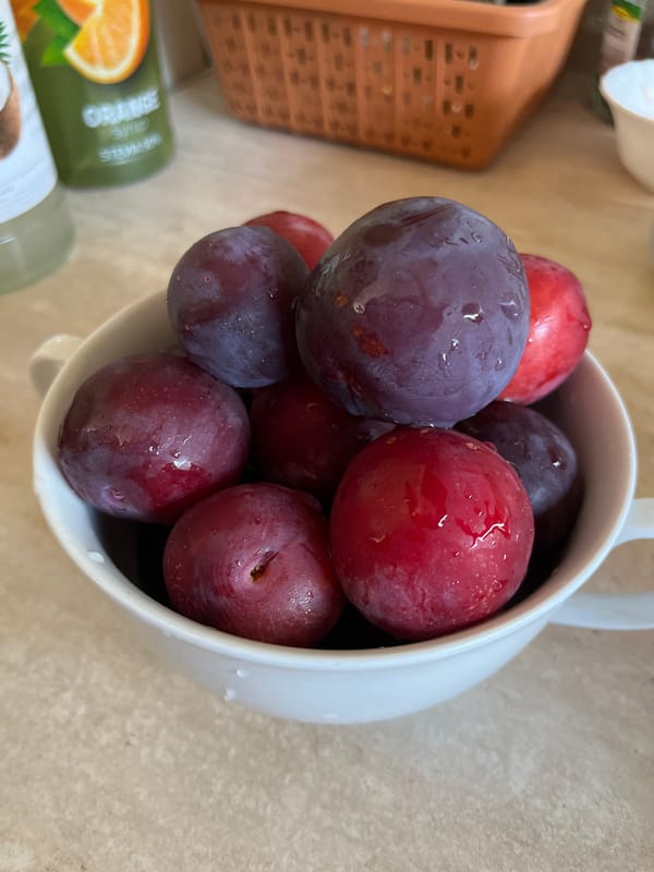 Morning food prep with fresh vegetables and plums in Shymkent