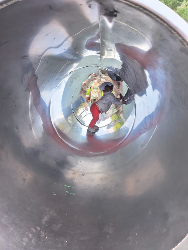Toddlers at a modern Sterlitamak playground on a summer afternoon