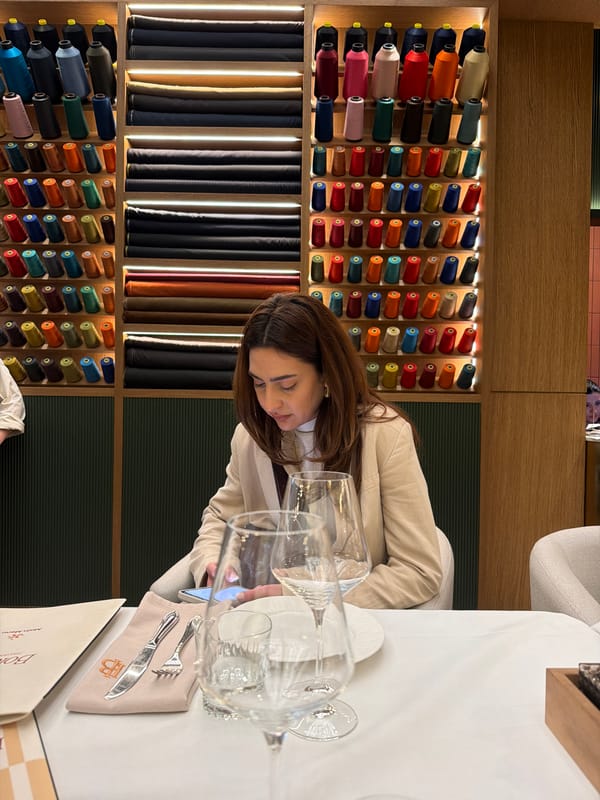Woman seated at table in Yerevan fashion shop