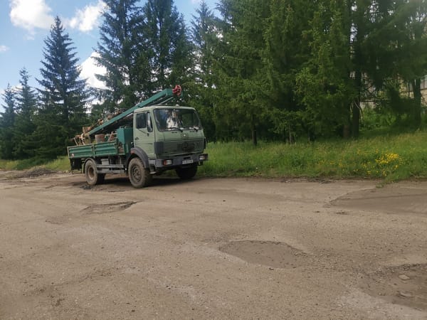 Crane truck spotted on damaged rural road in Zhivkovo