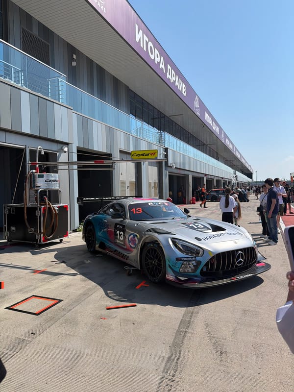 GT3 cars out at a sun-drenched race circuit