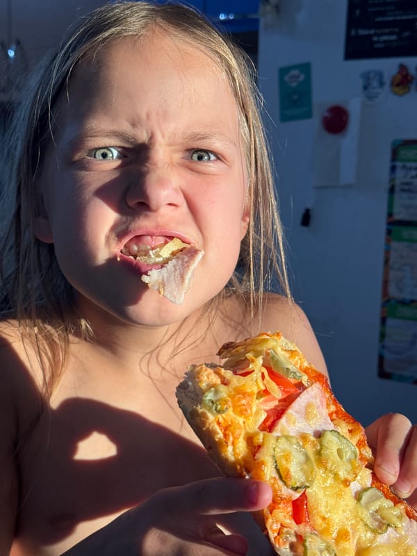 Pizza afternoon in Rusalevka with a corgi stealing the show