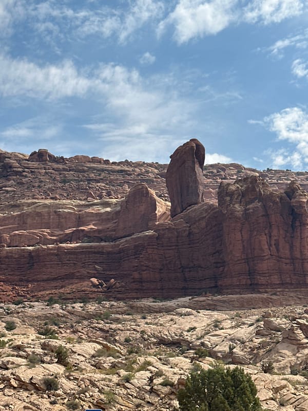 Red rock formations and open road outside Moab, Utah