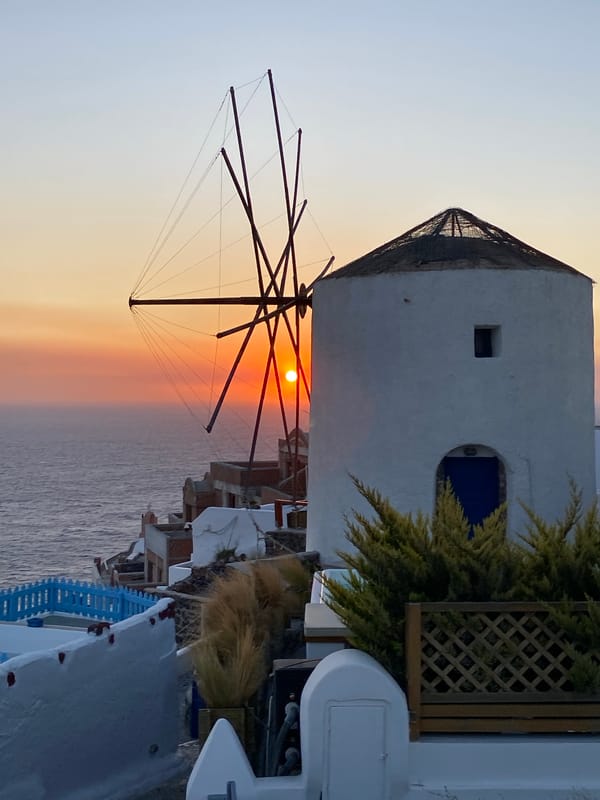Sunset hour at Oia's windmills, Santorini