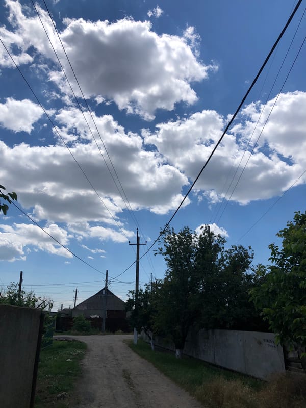 Rural road and power lines near Izmail on a clear summer day