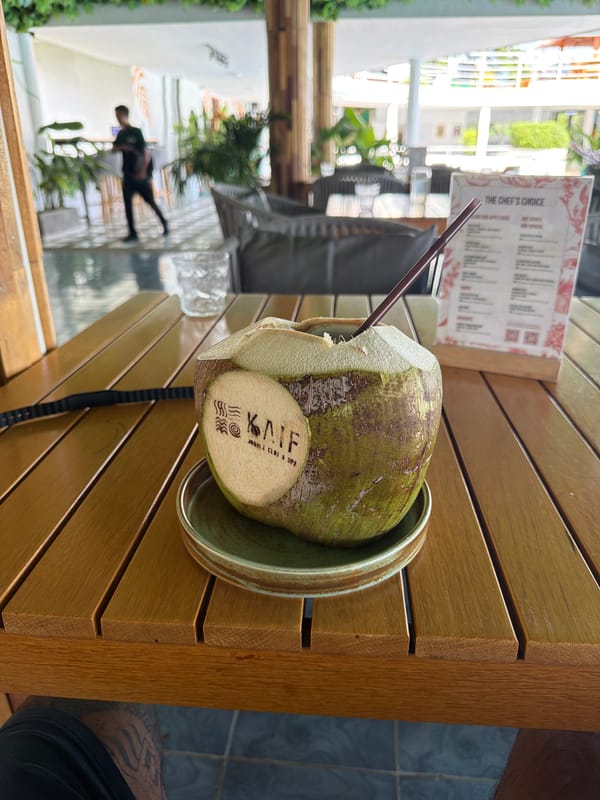 Coconut drink photographed at outdoor dining spot in Kathu