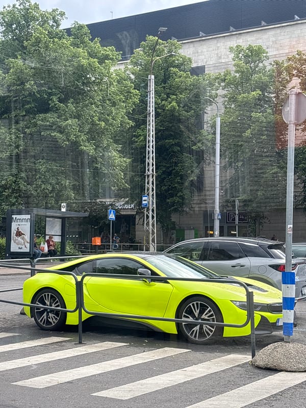 Neon BMW and mixed architecture across central Tallinn