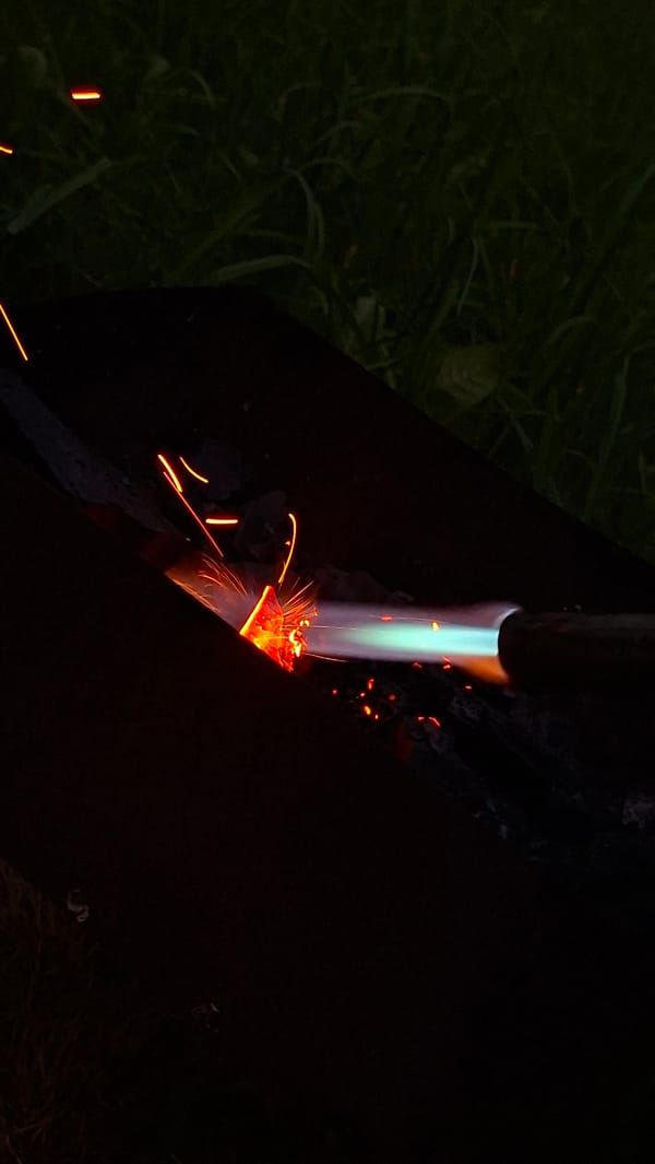 Midsummer backyard bonfire night in rural Belarus