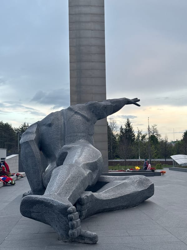 Visitor documents war memorial sculptures and eternal flame in Kazan