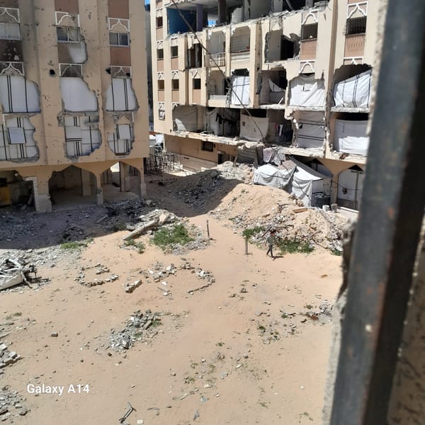 Damaged buildings documented in Khan Yunis amid daily life