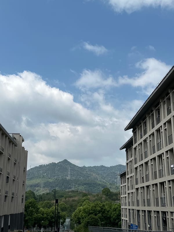 Urban skyview captures mountains and clouds in Jiangjin, China