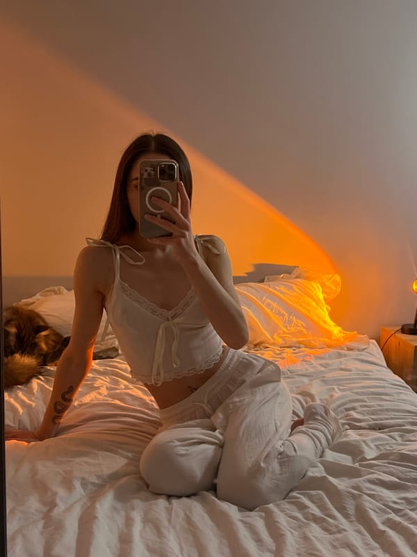 Person takes bedroom selfies in white clothing in Ternopil