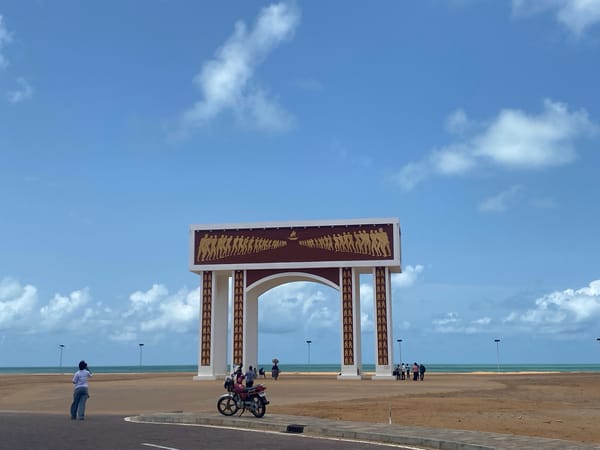 Visitors documented at Gate of No Return monument in Benin