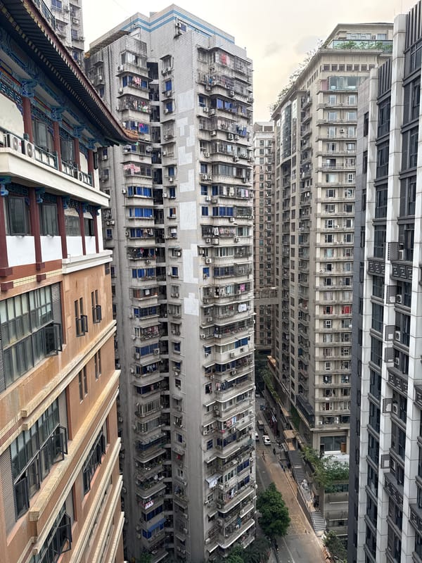 Tourists photograph mixed architecture in Yuzhong District, China