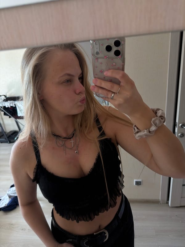 Woman takes mirror selfie series in Izhevsk bedroom