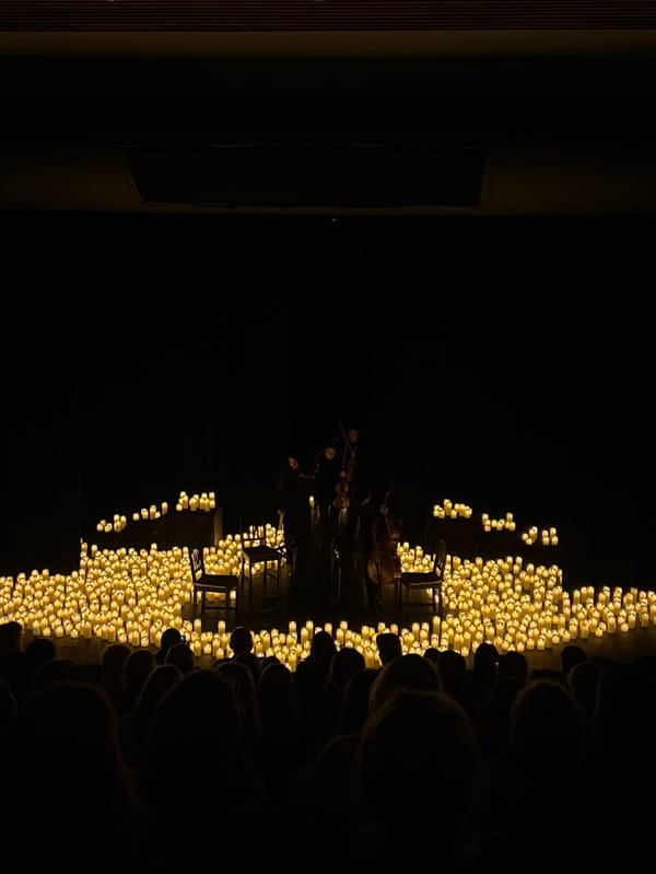 Musicians perform by candlelight in pre-dawn Whistler gathering