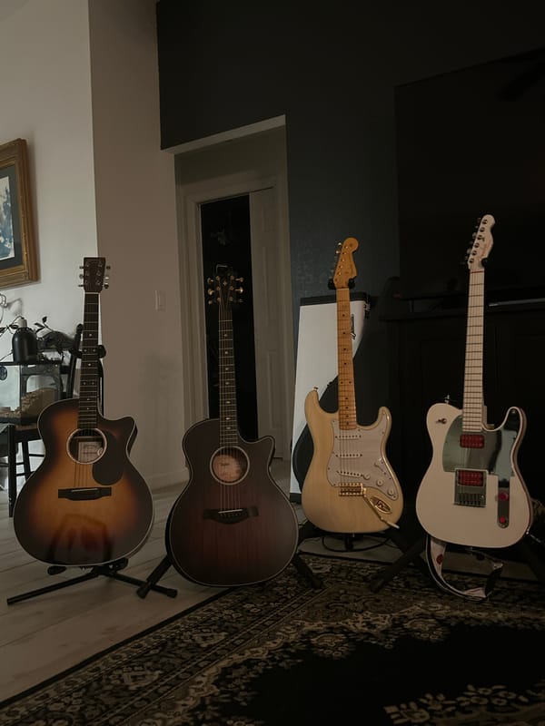 Four guitars displayed on stands in Cape Coral home