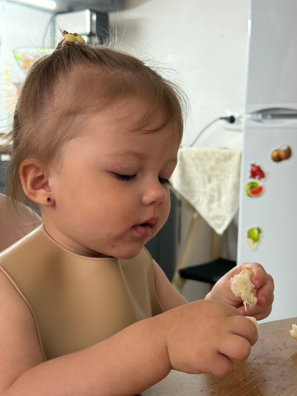 Toddler enjoys breakfast in Reshetnikovo, Russia