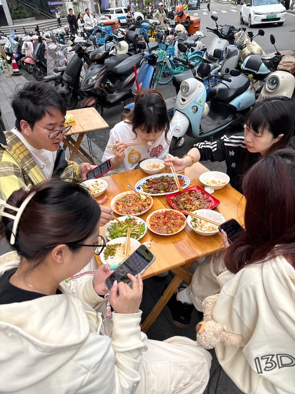 Tourist selfies with decorative yak display in Chengdu district