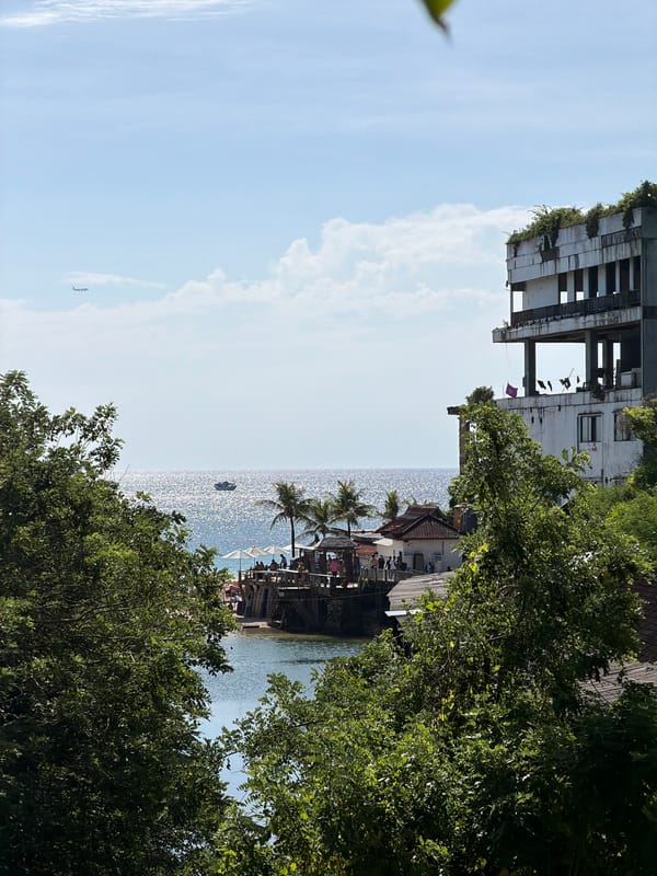 Coastal view with overgrown ruins captured in Kuta Selatan