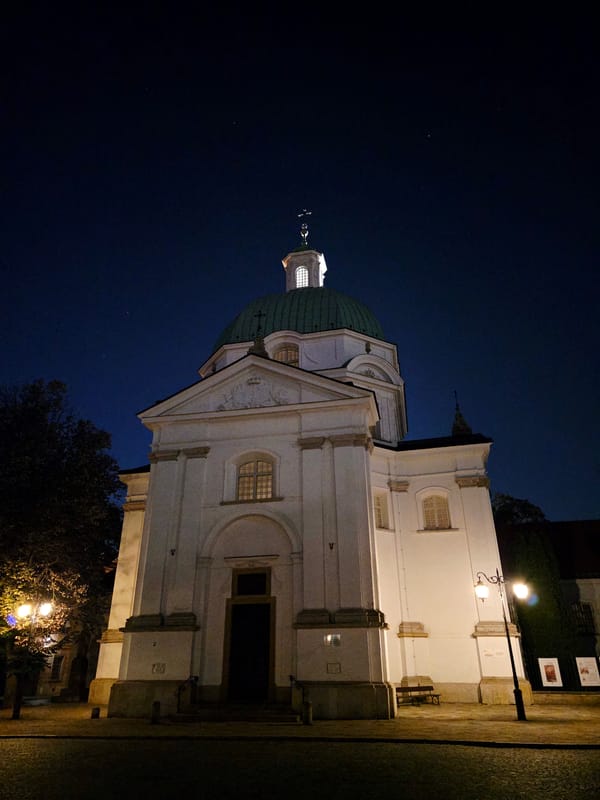 Warsaw Old Town at night, churches, cobblestones, and cafe terraces