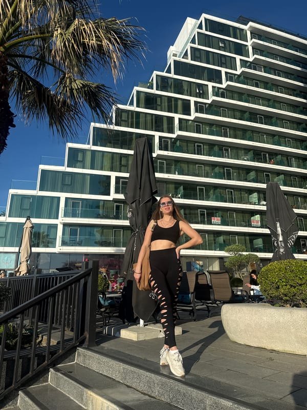 Woman in athletic wear spotted near modern building in Batumi