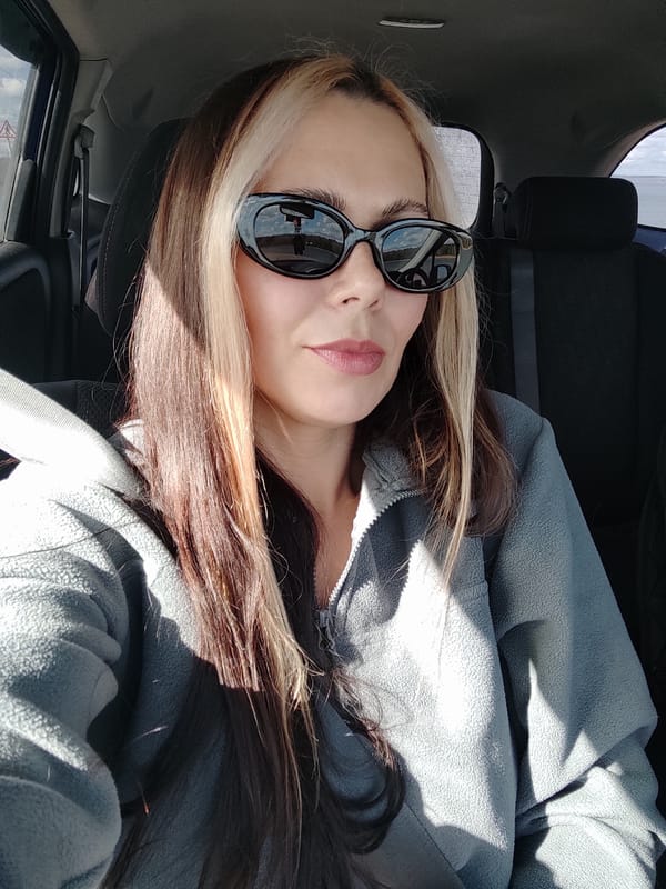 Woman takes car selfie in Noviy, Russia