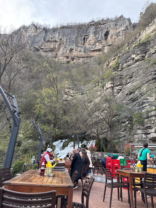 Diners gather at cliffside waterfall restaurant in Milanovo, Bulgaria