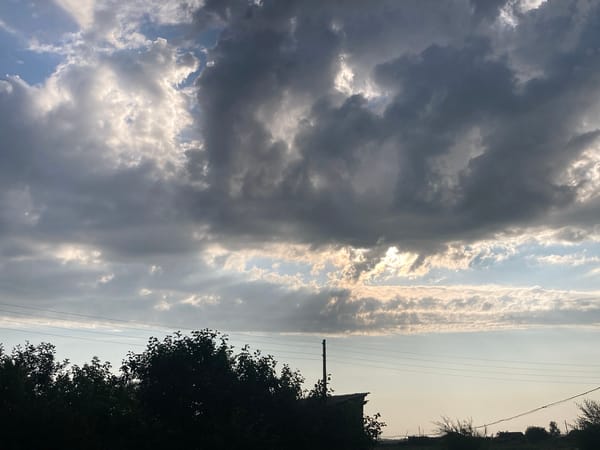 Dramatic skies roll over a rural Russian village