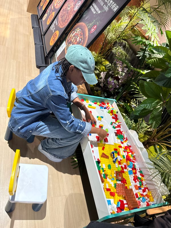 Person builds with Lego bricks indoors in Beijing