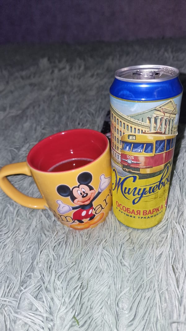 Drinks, vapes, and sports ads in a casual home setting