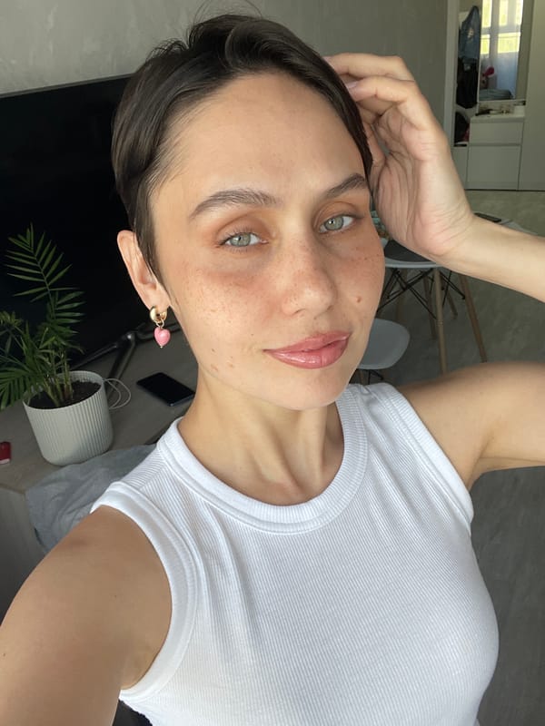 Woman takes morning selfies in bedroom in Izhevsk
