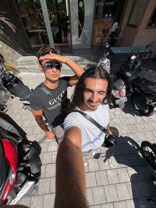 Two men photographed among motorbikes in North Kuta