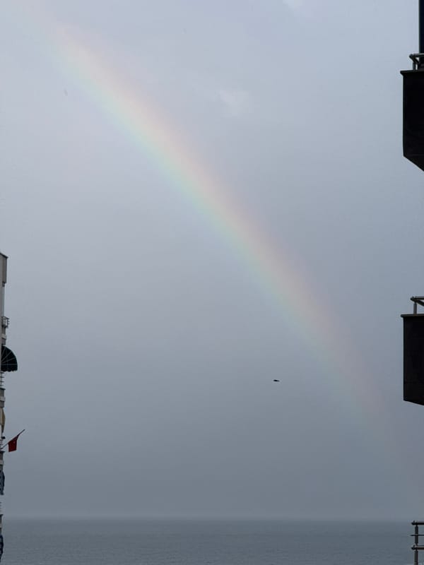 Rainbow appears over apartment buildings in Erdemli, Turkey
