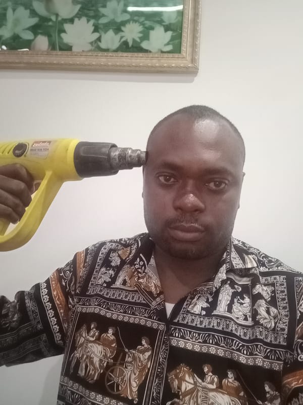 Man photographed indoors in Gwarinpa, Nigeria
